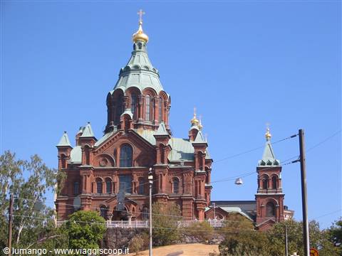 Uspenski Orthodox Cathedral in Helsinki, red brick with green golden domes