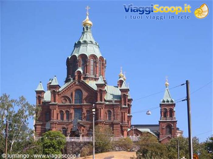 Uspenski Orthodox Cathedral in Helsinki, red brick with green golden domes