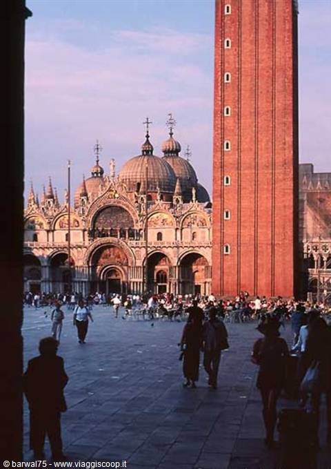 St Mark's Square in Venice: basilica and brick bell tower under pink sky