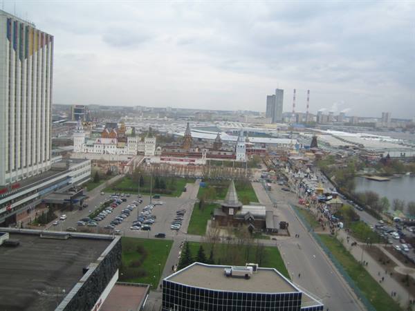 Aerial view of the Izmailovo complex in Moscow with colorful towers and parking lot