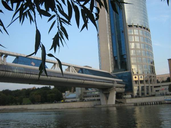 Bagration pedestrian bridge and glass skyscrapers of Moscow City by the river