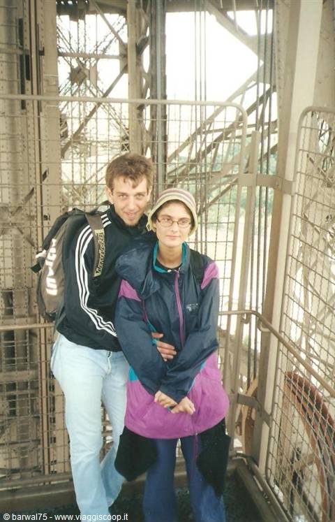 tourist couple on the iron staircase of the Eiffel Tower, Paris