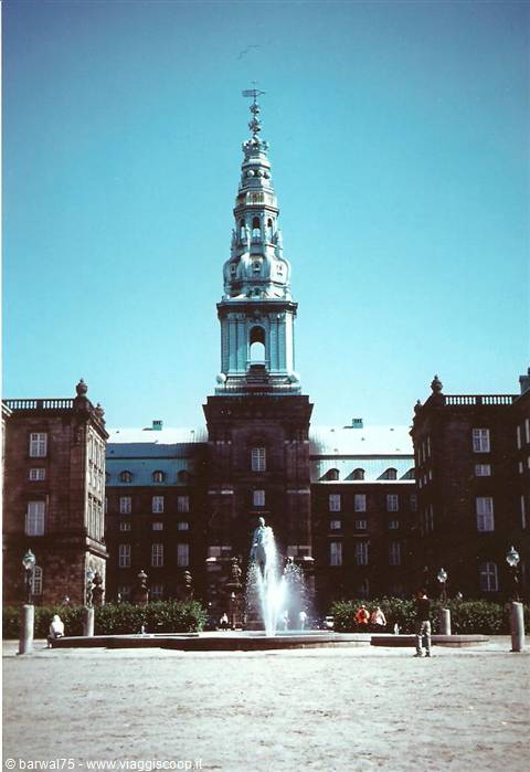Christiansborg spire in Copenhagen rising above the square fountain