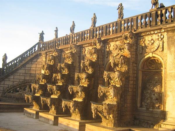 Baroque stone fountains with statues, Zwinger Nymphenbad, golden light