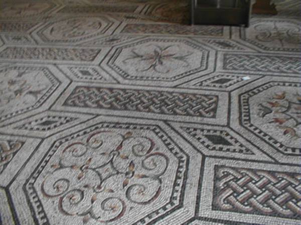Mosaic floor with geometric and floral marble patterns in white and red