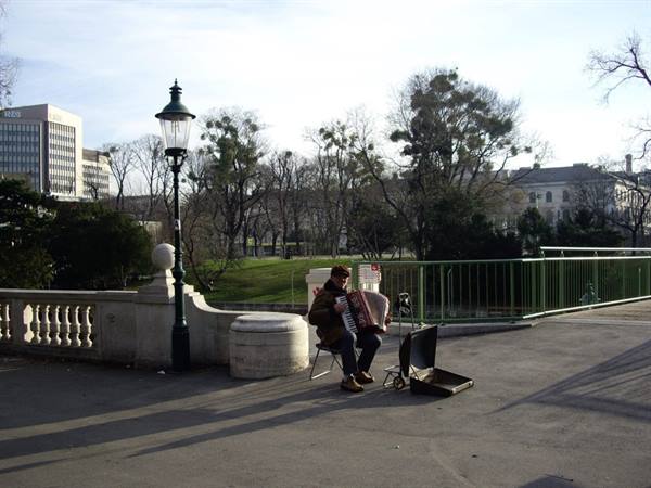 Accordion player on a bridge in Vienna Stadtpark
