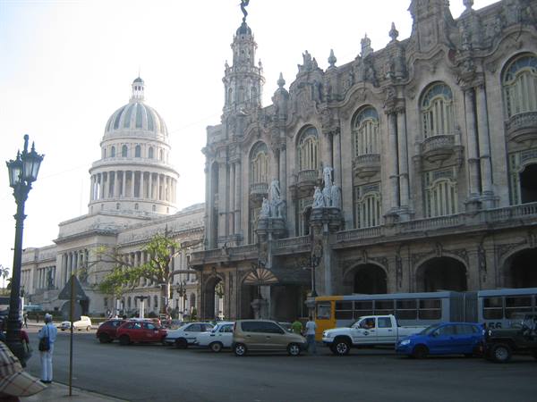 Havana: the Capitolio dome and ornate stone Gran Teatro with street traffic