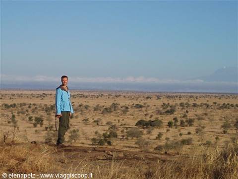 Marco at Lion's Rock, Kilimanjaro's shadow in the background