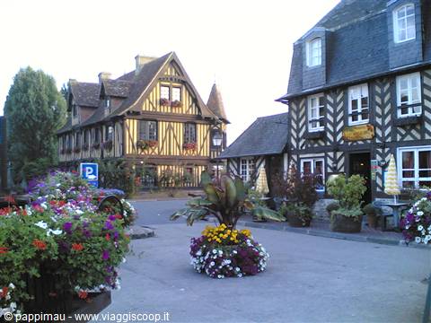 Half-timbered houses and flower beds in Dives-sur-Mer square