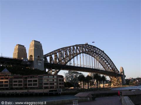 The steel Sydney Harbour Bridge against a clear blue sky