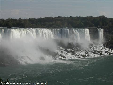 Niagara Falls: white water curtains over rocks, mist rising above green river