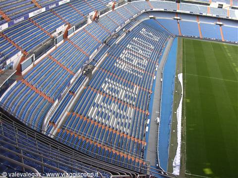 Empty stands and green pitch at the Santiago Bernabéu stadium in Madrid