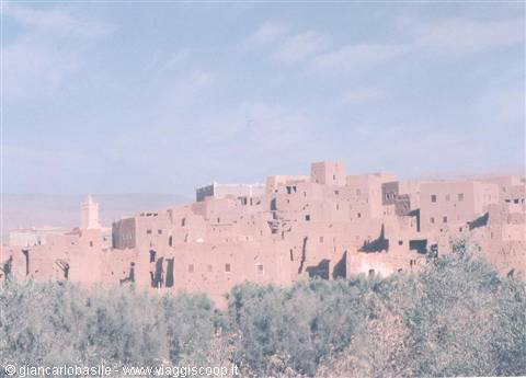 Ait Ben Haddou ksar, red mud-brick houses among palm trees