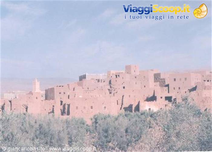 Ait Ben Haddou ksar, red mud-brick houses among palm trees
