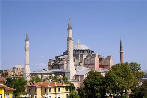 Hagia Sophia in Istanbul with minarets and dome under blue sky