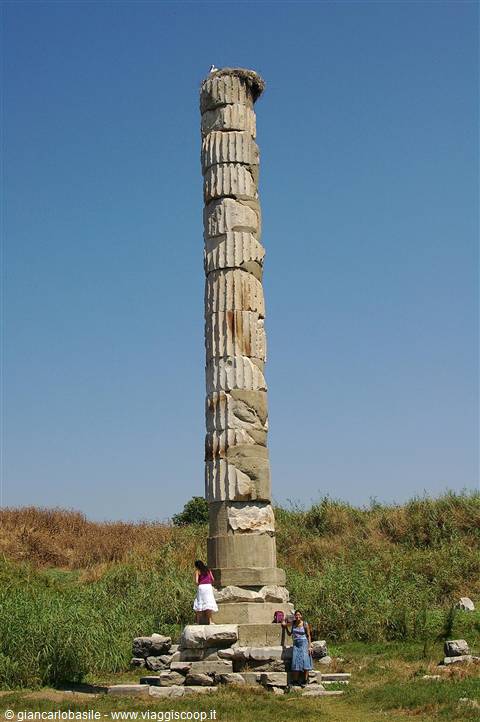 Marble column of the Temple of Artemis at Ephesus, tourists at base