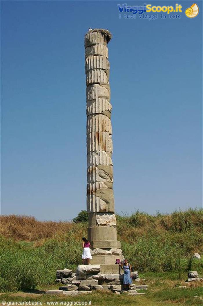 Marble column of the Temple of Artemis at Ephesus, tourists at base