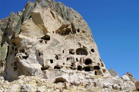 Volcanic rock face carved with caves and openings, Göreme, Cappadocia