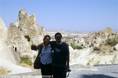 Couple in front of Cappadocia's carved rock formations