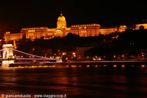 Buda Castle lit up and Chain Bridge over the Danube at night