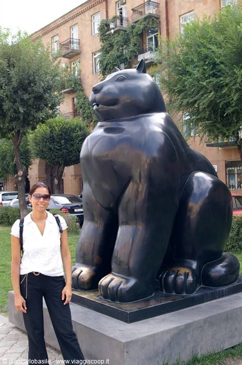 Woman beside Botero's bronze Cat sculpture in Yerevan