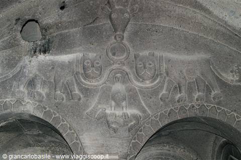 Medieval stone relief carving: two lions flanking an animal, Geghard monastery