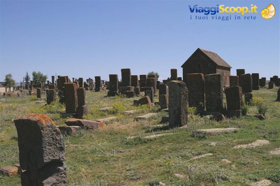Noratus medieval cemetery, stone khachkar cross-slabs standing among the grass