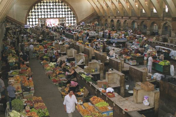 Yerevan covered market: fruit stalls under the round skylight roof