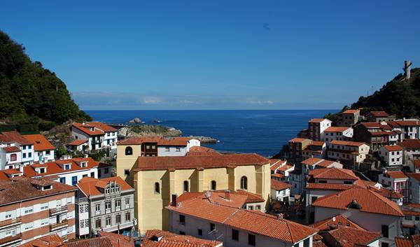 Cudillero: red rooftops and yellow church overlooking the sea