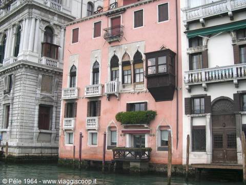 Pink and white palaces with balconies overlooking the Grand Canal in Venice