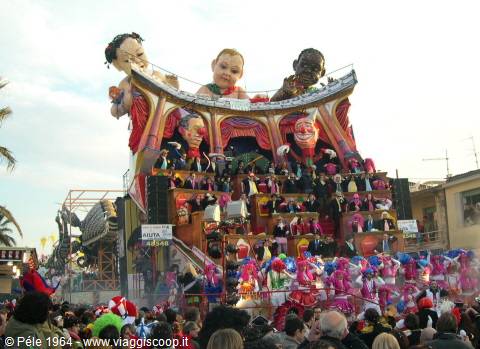 Viareggio Carnival: papier-mâché float with giant masks and costumed dancers