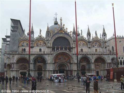 St Mark's Basilica in Venice with tourists under a grey sky