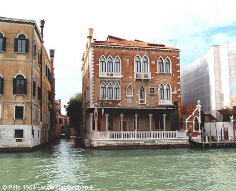Red brick palace overlooking the Grand Canal in Venice, daylight