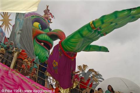 Viareggio Carnival: allegorical float with green witch and giant hand