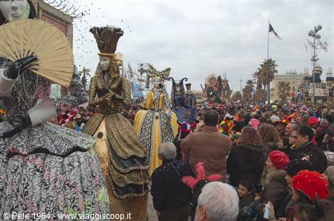 Viareggio Carnival: costumed parade floats among cheering crowds