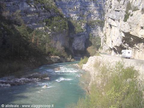 Camper van on cliffside road, turquoise river, Verdon Gorge